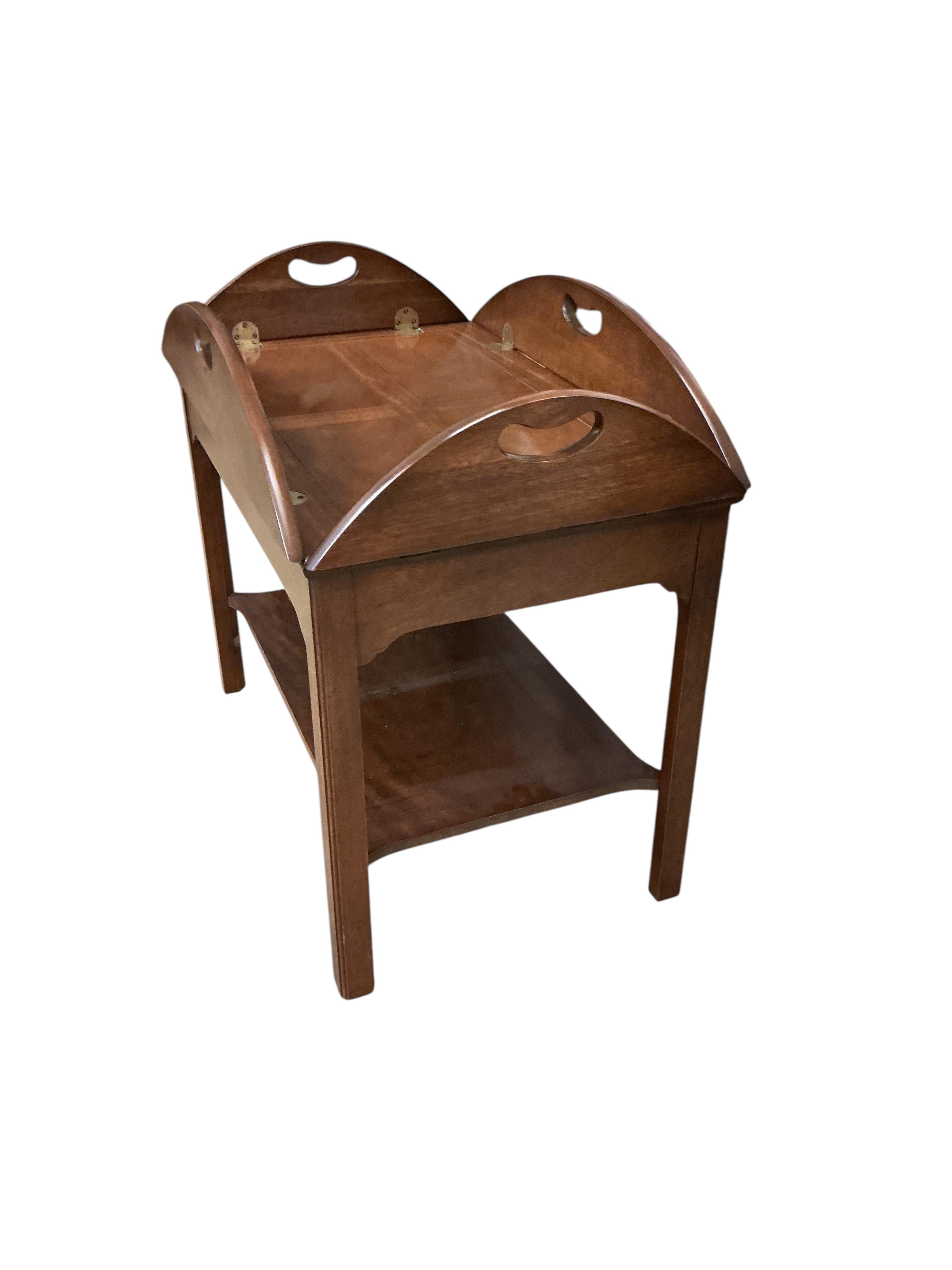 A reproduction George III style mahogany butler's tray, on stand, width 74cm, depth 48cm, height 68cm